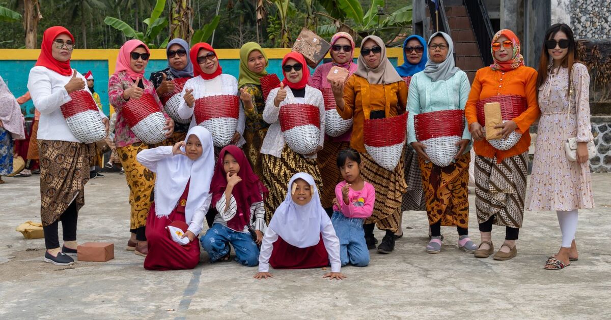 Group of Indonesian people in traditional clothing celebrating a festival in Pacitan, East Java.