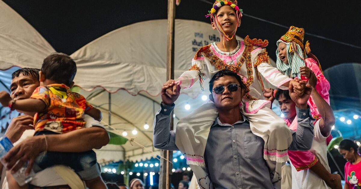 Joyful celebration at a traditional festival in Bangkok, Thailand.